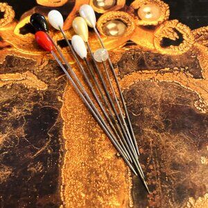 Septet of bright vintage glass stickpins